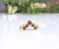 Ruby chevron ring in 18k gold with five natural rubies, perfect for anniversaries and as a special gift.