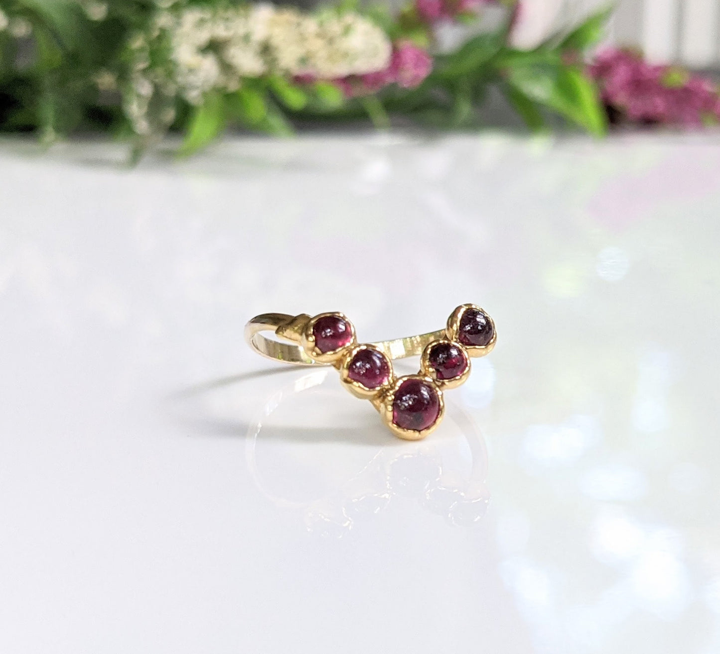 Ruby and gold filled chevron ring set with five natural rubies, perfect for a unique wedding or fashion style.