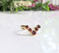 Ruby and gold filled chevron ring set with five natural rubies, perfect for a unique wedding or fashion style.