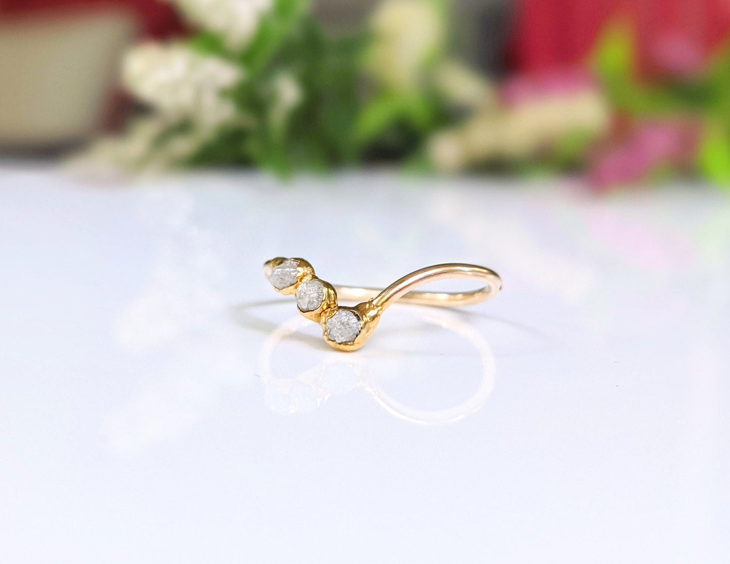 Raw diamond Chevron ring in 18k gold, featuring three conflict-free diamonds, a unique and romantic wedding piece.