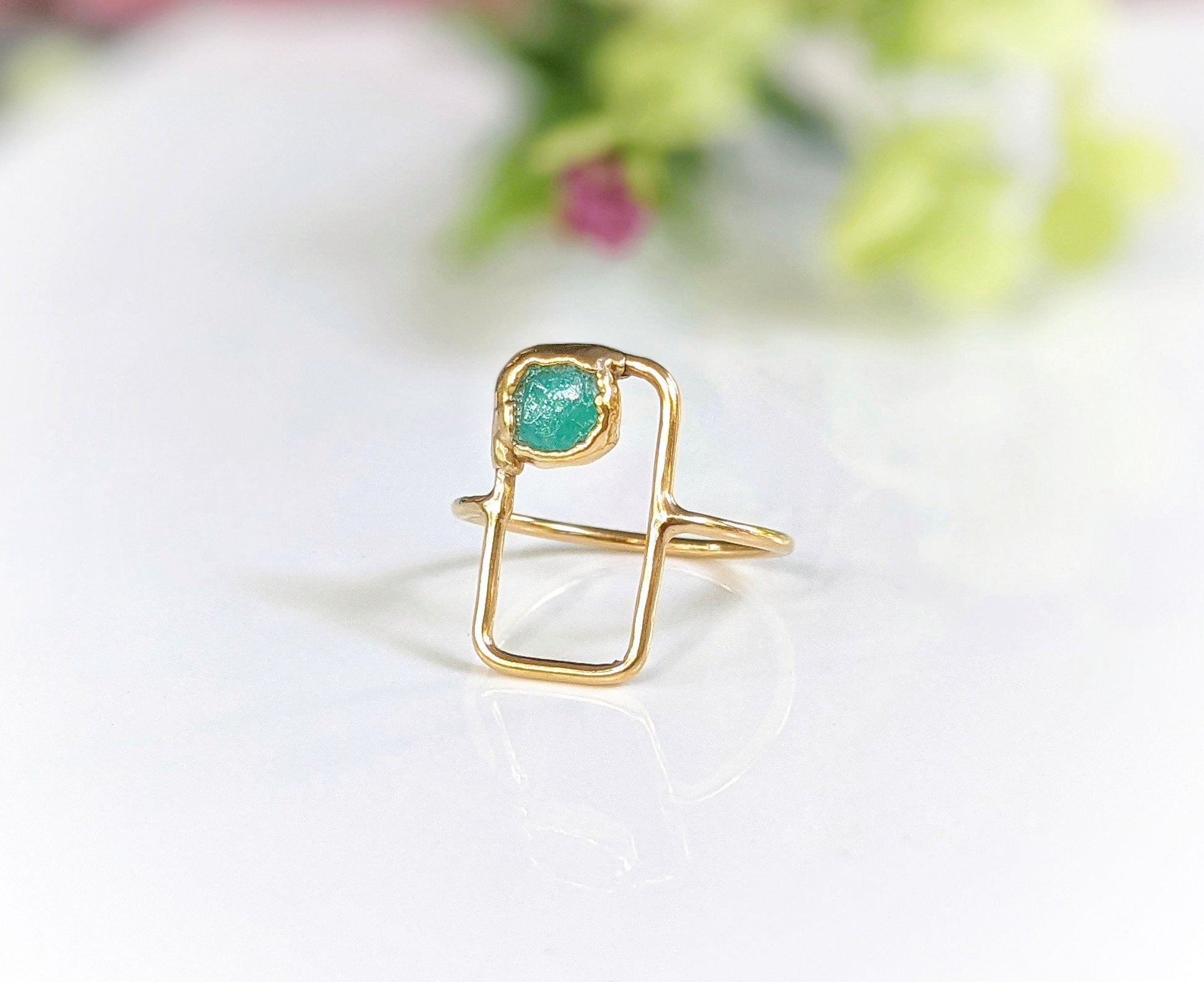 Modern geometric ring featuring raw blue Peruvian Opal set on a dainty 14k gold band.