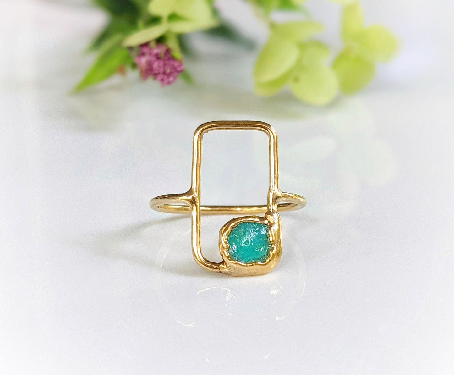 Modern geometric ring with raw blue Peruvian opal on a rectangular 14k gold band, perfect for any occasion.