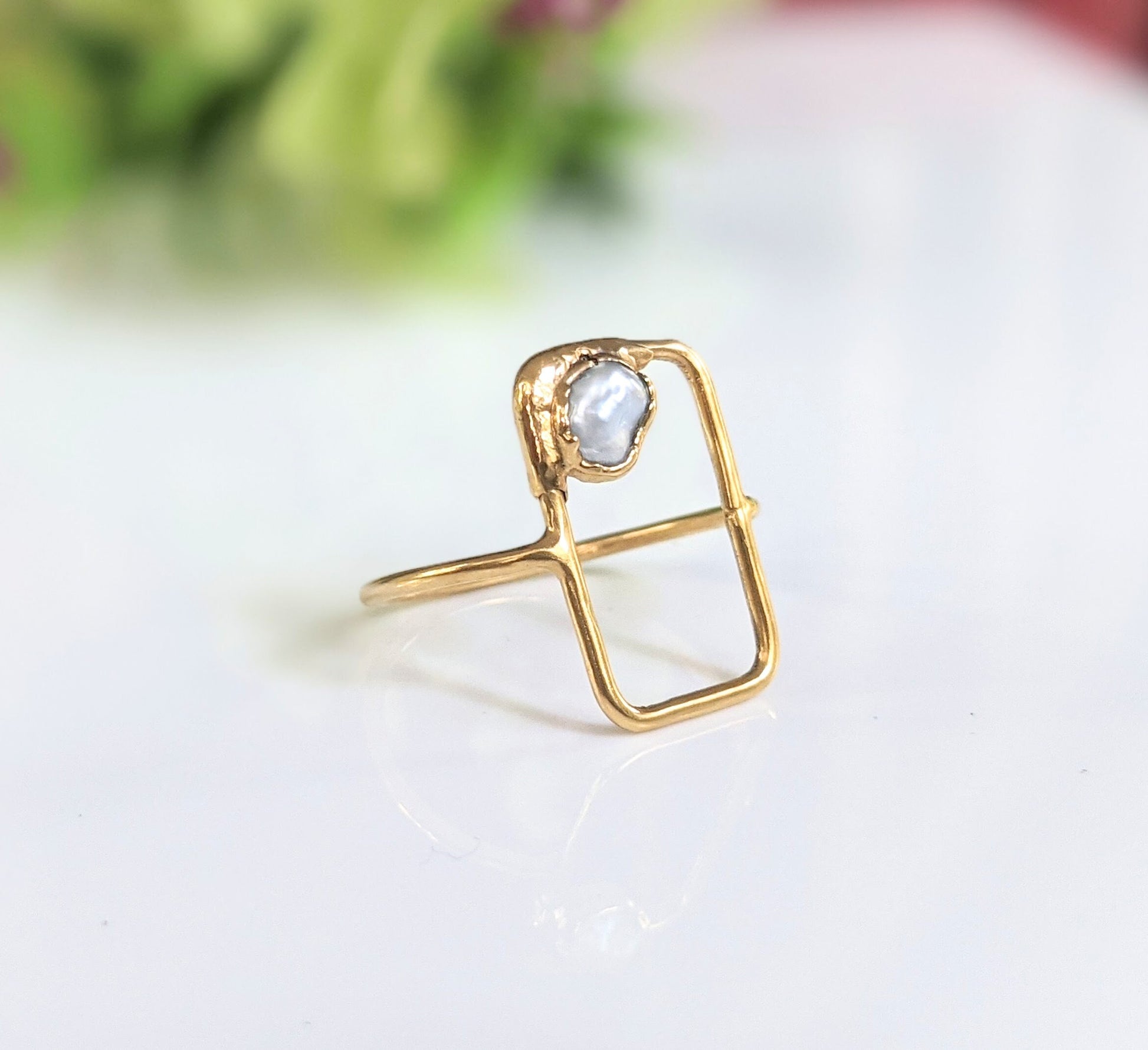 Handcrafted geometric freshwater pearl ring with 14k gold band, unique gift for love and friendship.