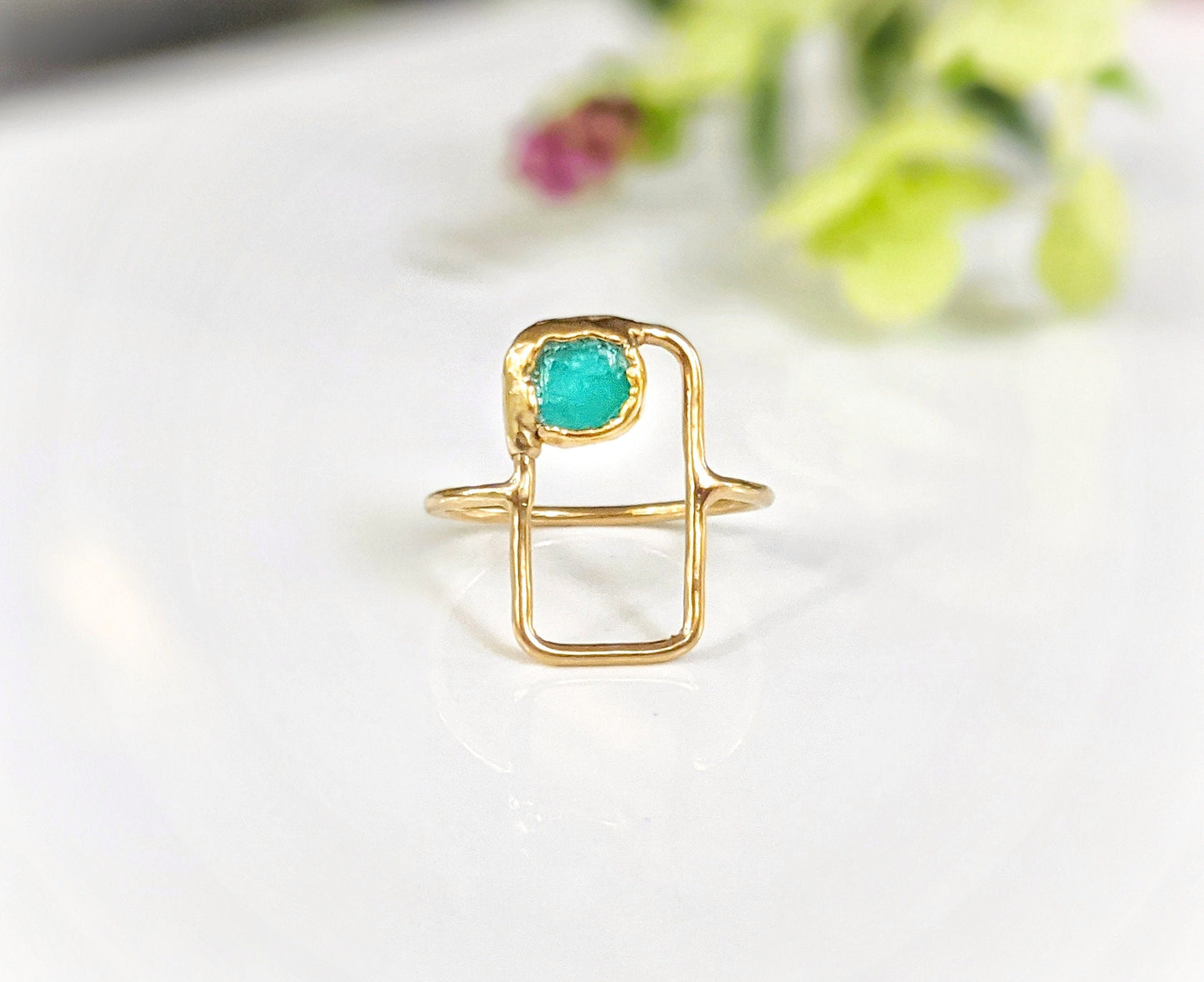 Raw Peruvian opal geometric ring on a gold band, featuring a natural blue opal in a modern design.