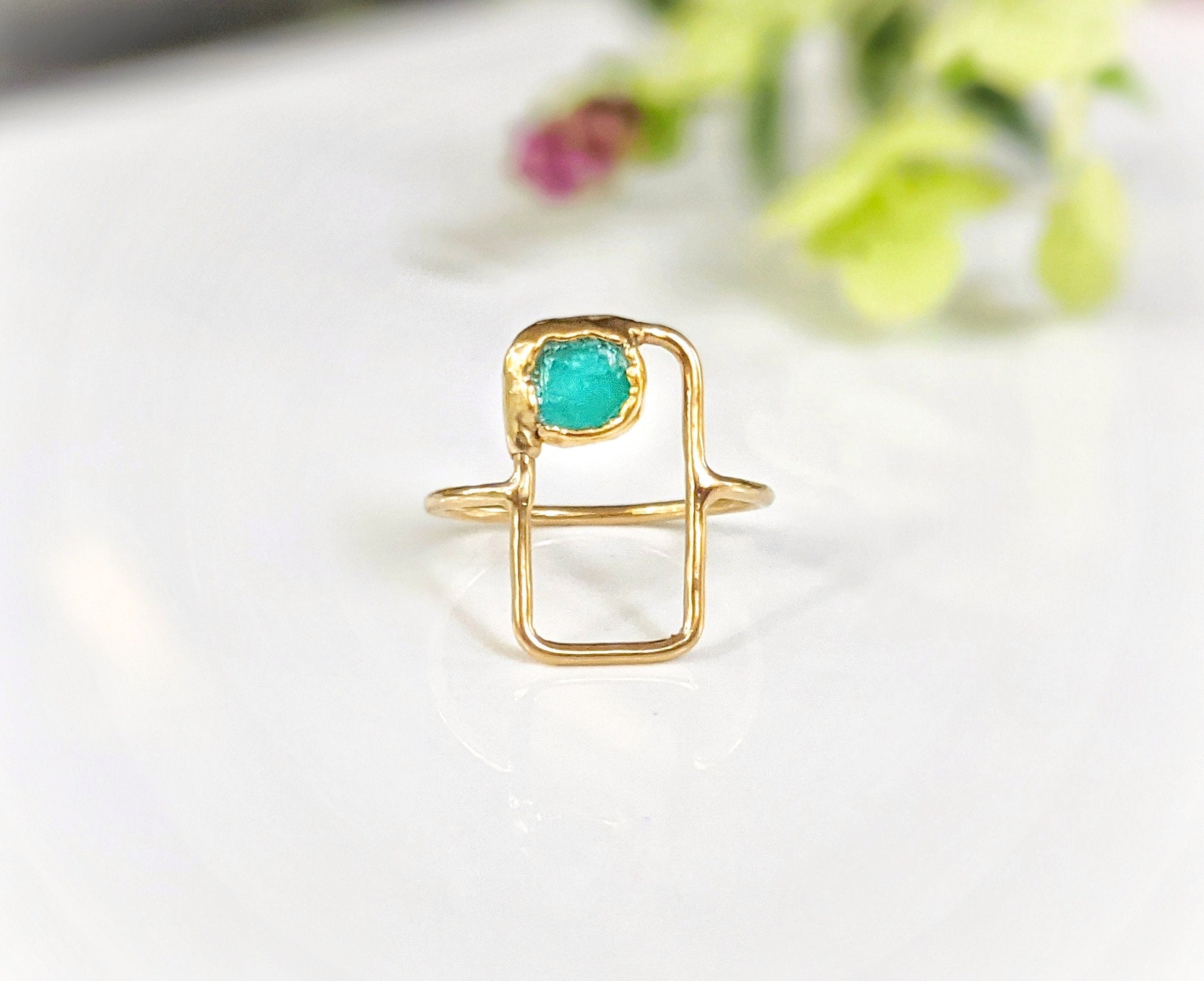 Raw Peruvian opal geometric ring on a gold band, featuring a natural blue opal in a modern design.