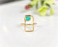 Raw Peruvian opal geometric ring on a gold band, featuring a natural blue opal in a modern design.