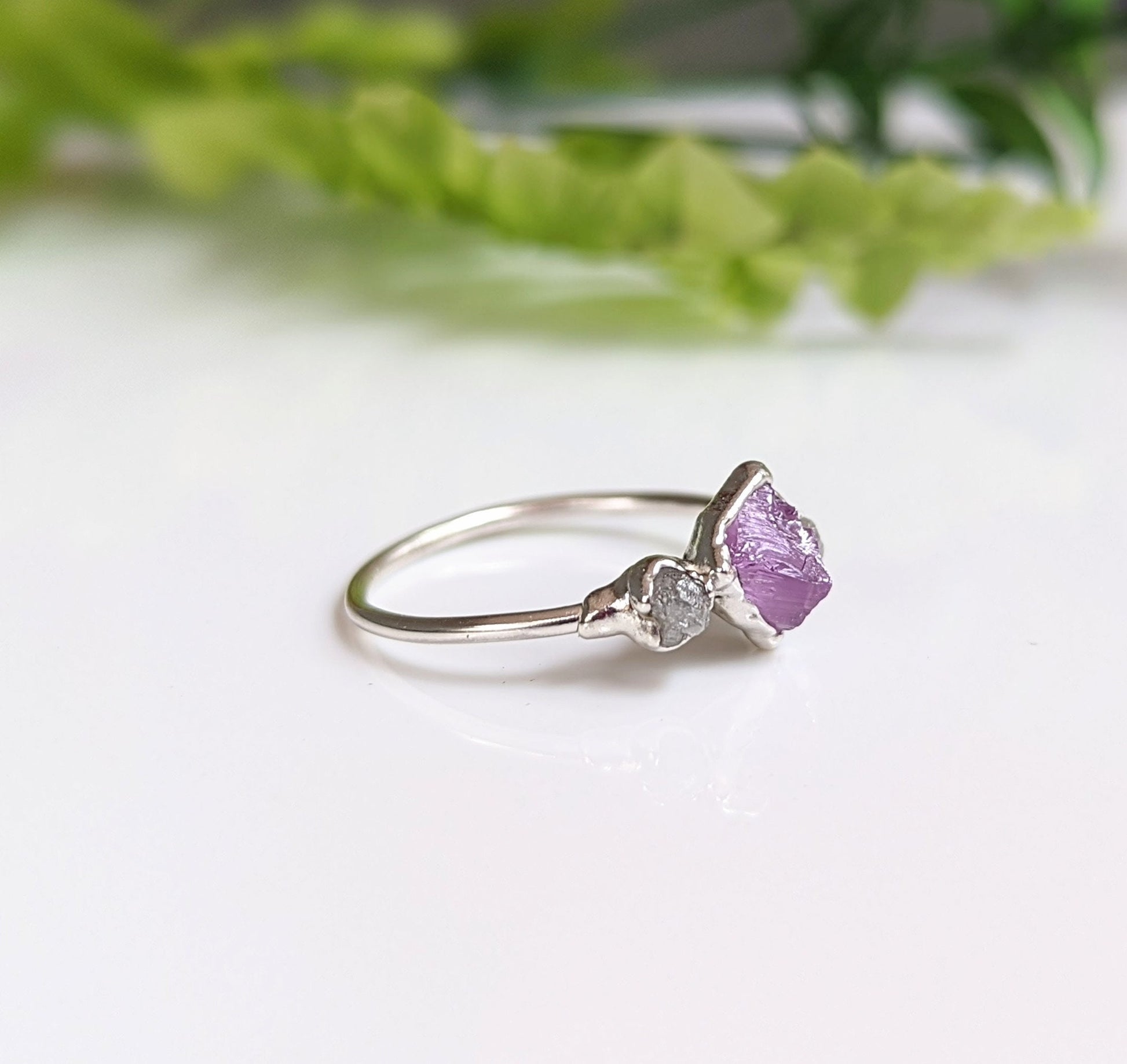 Handcrafted raw Alexandrite and diamond silver ring, featuring a unique design, perfect for engagement or special occasions.