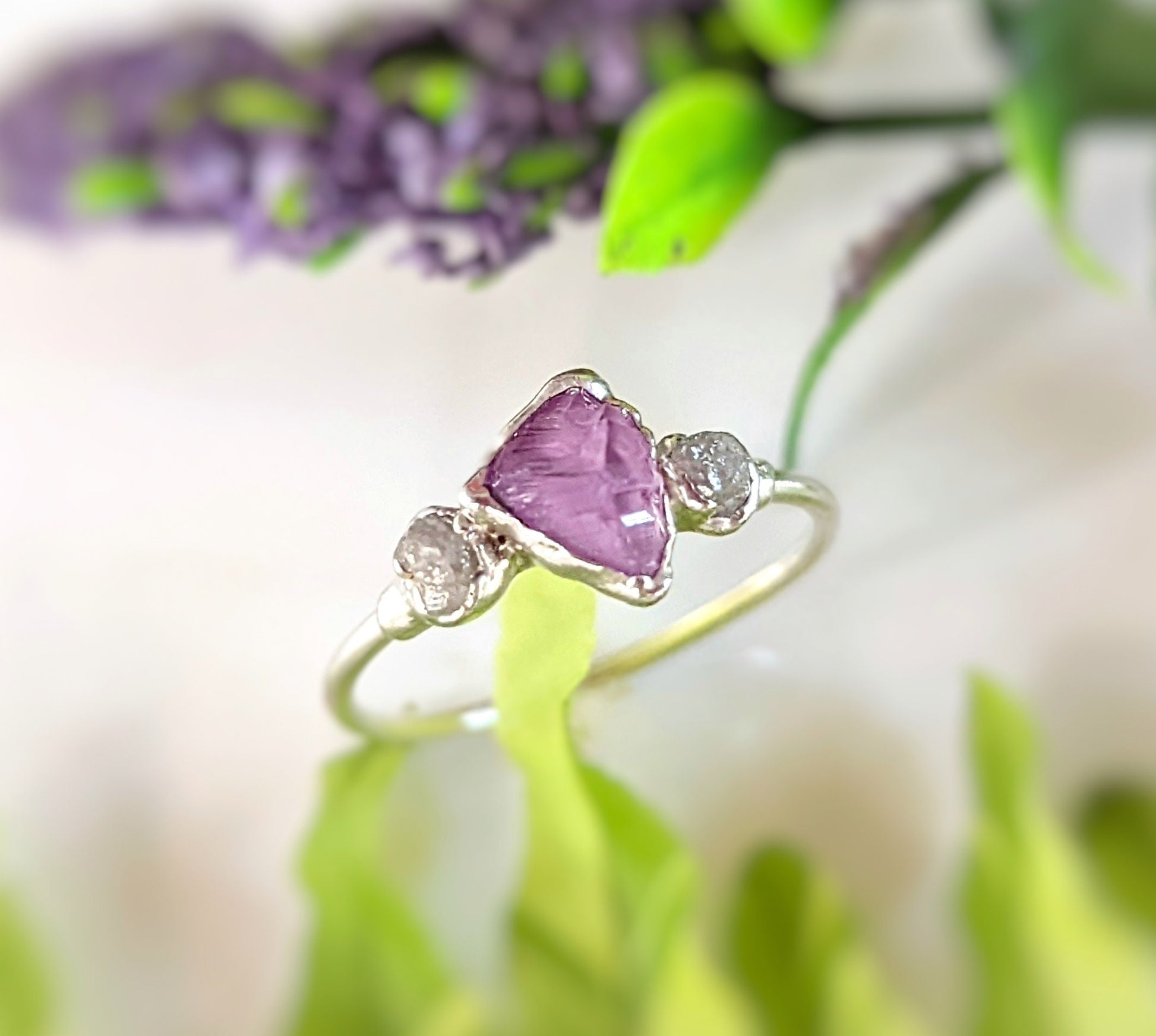 Raw Alexandrite and diamond silver ring with a unique handcrafted design featuring a June birthstone.