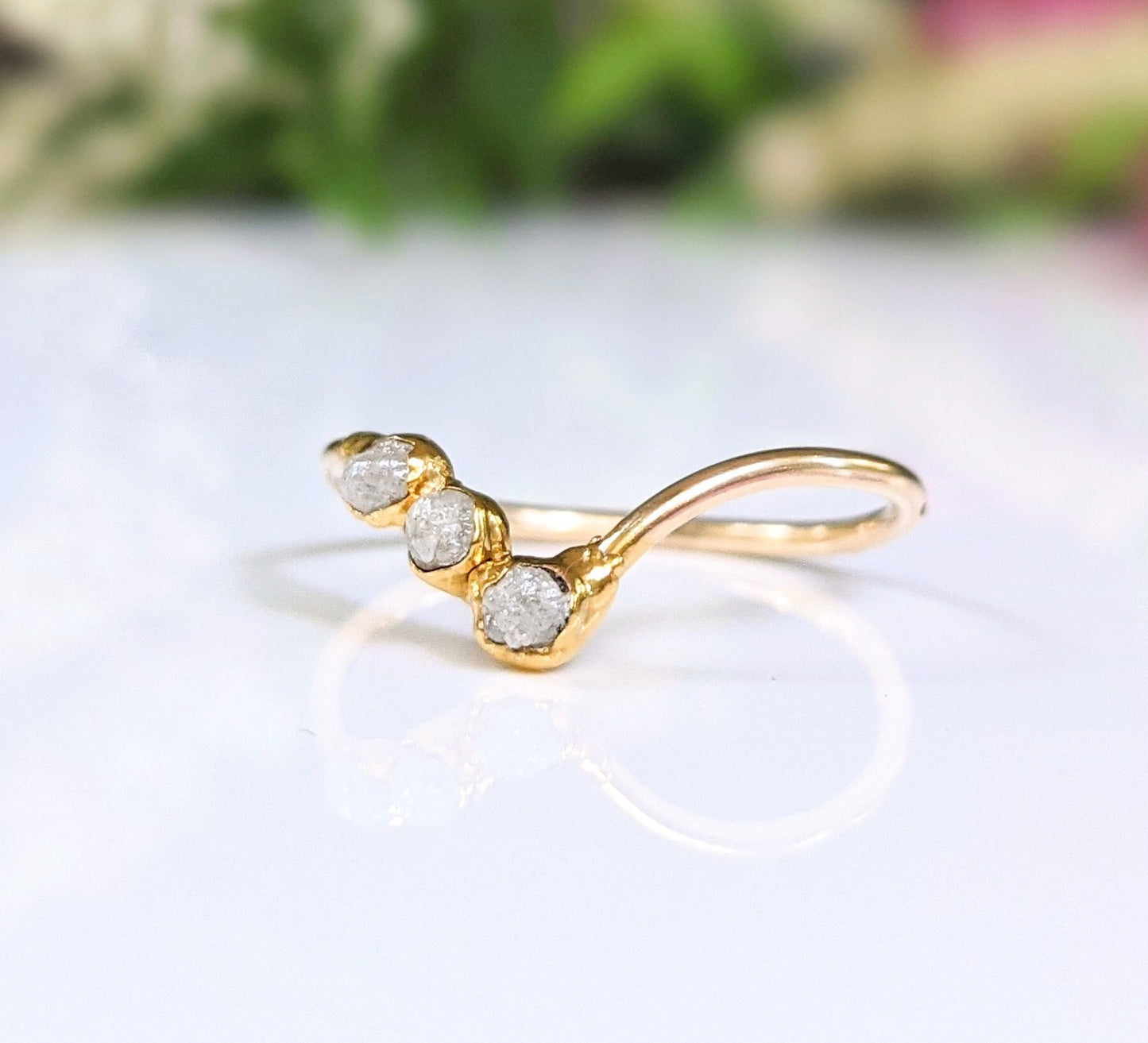 Raw diamond Chevron engagement ring in 18k gold, featuring three unique conflict-free diamonds.