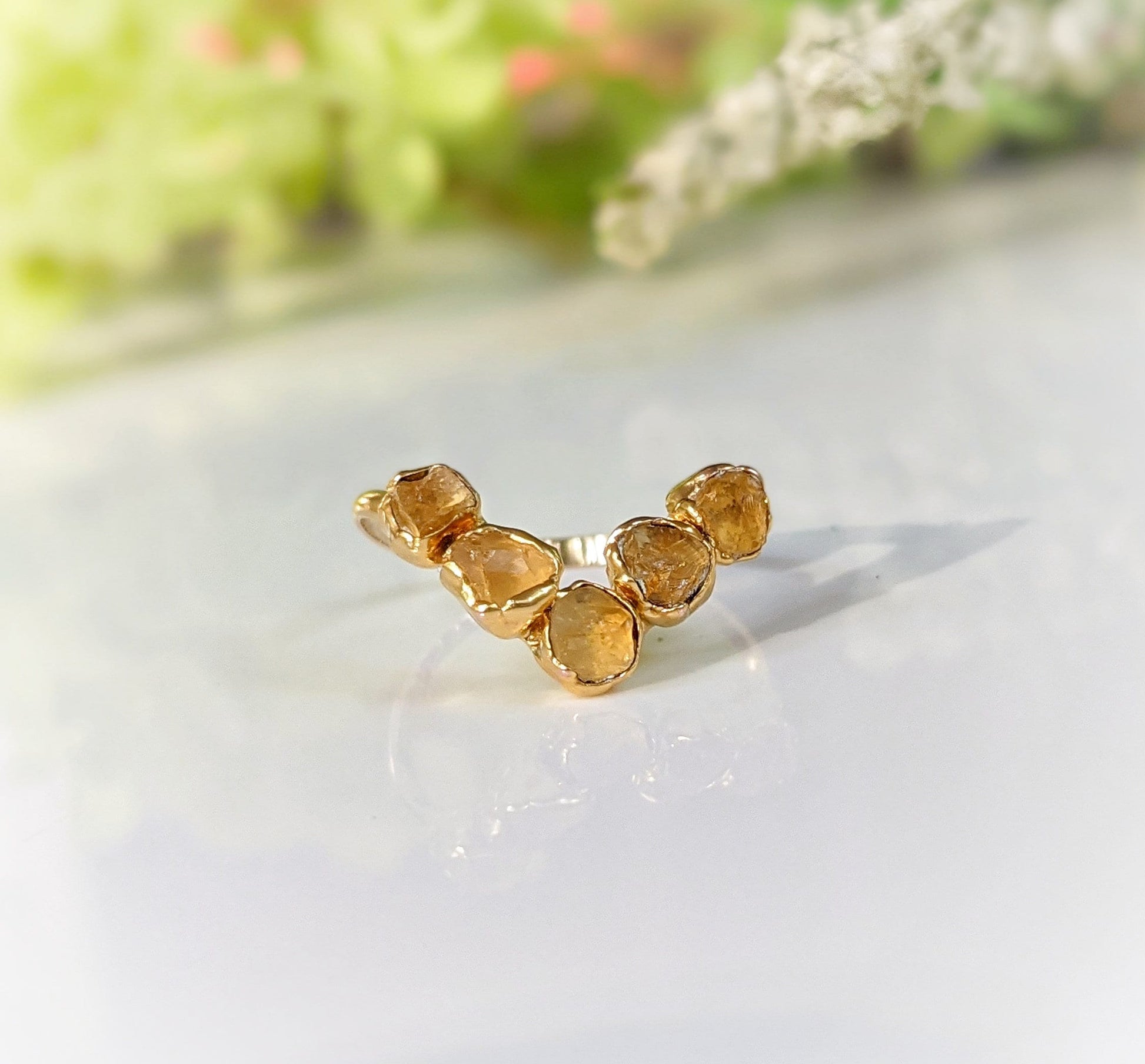 Raw Citrine Chevron ring set with five natural stones on a gold band, perfect for November birthdays.