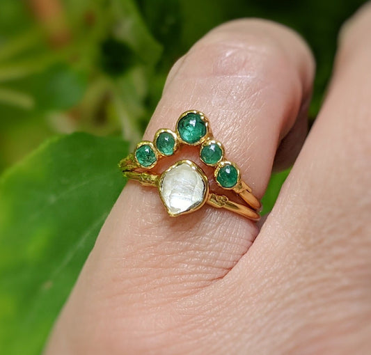Emerald and Herkimer diamond wedding ring set featuring gold band and delicate design.
