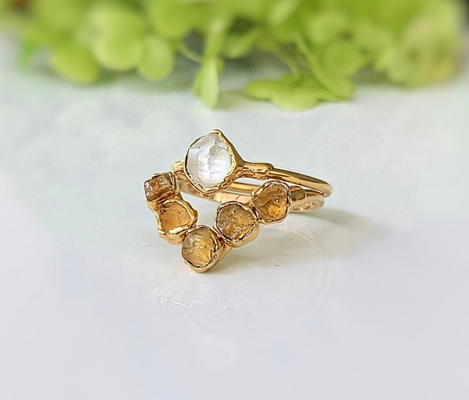 Raw citrine and Herkimer diamond chevron engagement ring on a 14k gold band, showcasing unique natural gemstones.