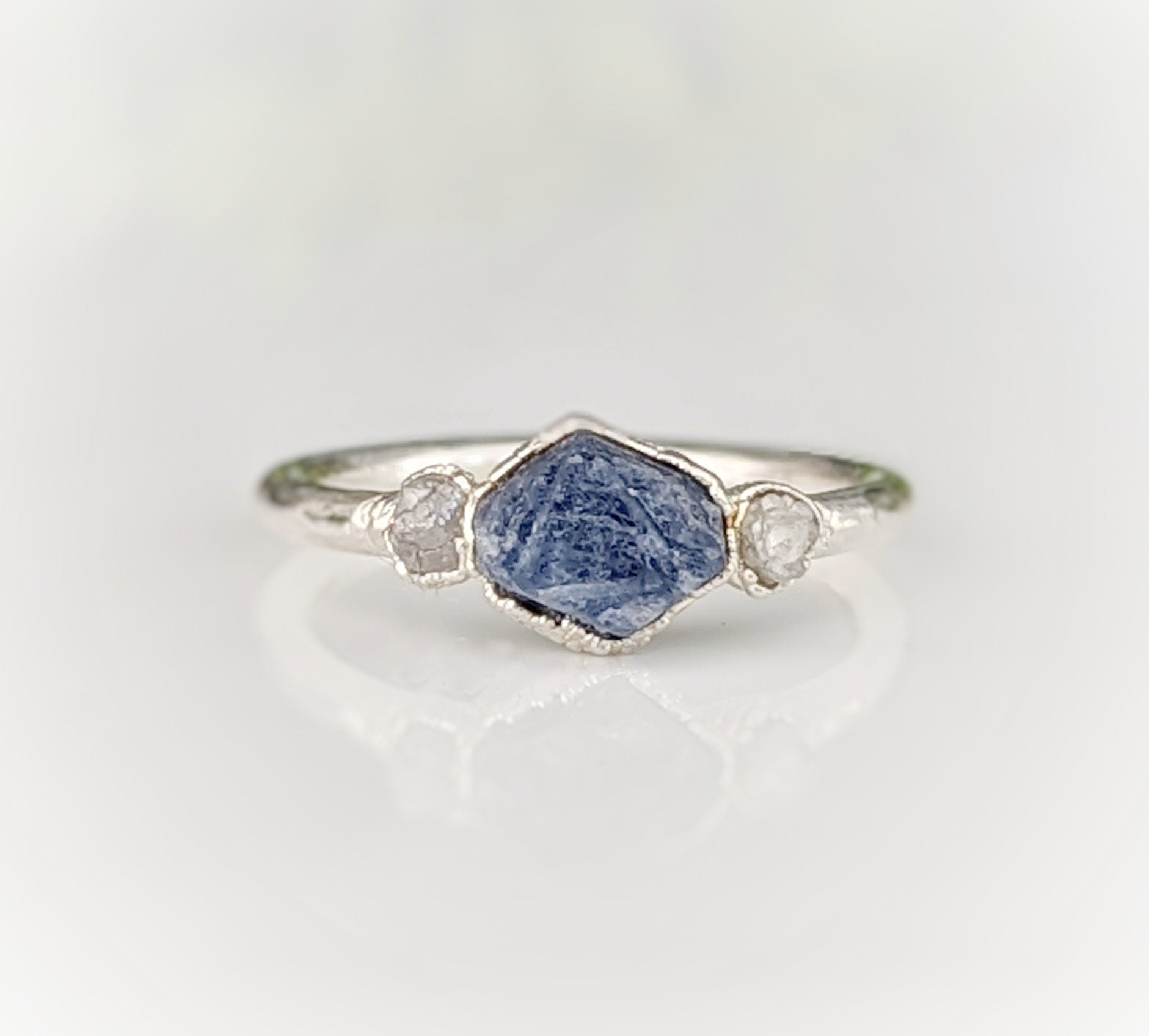 Raw sapphire and rough diamond ring, showcasing unique rustic beauty and ethical craftsmanship.