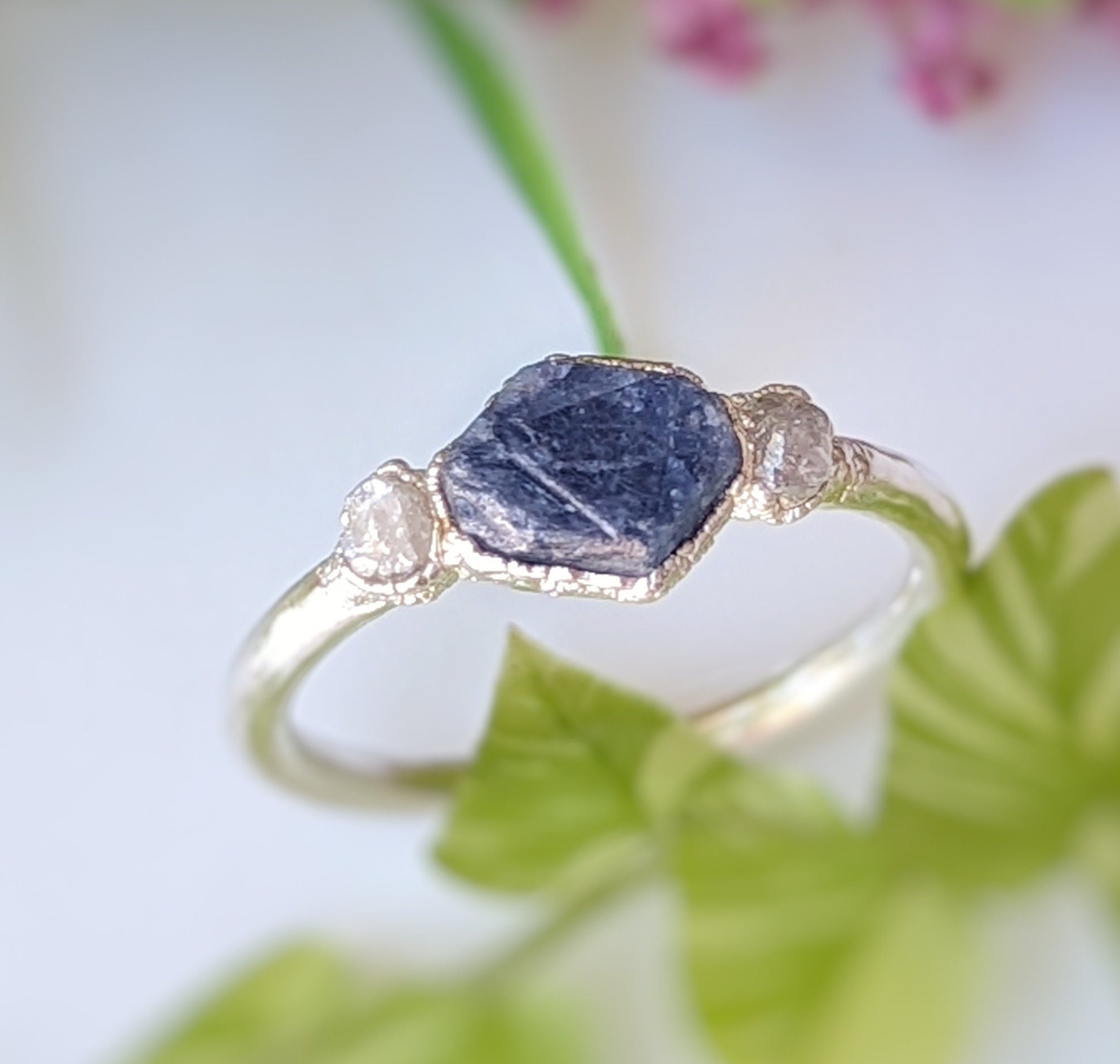 Raw sapphire and rough diamond ring, showcasing rustic beauty and unique design, ideal for love celebrations or September birthstone gifts.