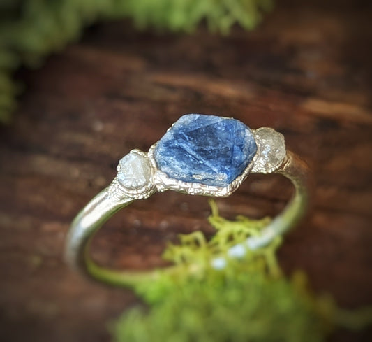 Raw sapphire and rough diamond ring, showcasing rustic elegance and ethical craftsmanship for a romantic gift.