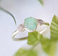 Handcrafted raw emerald and rough diamond ring, showcasing rustic elegance, ideal for engagement or special occasions.