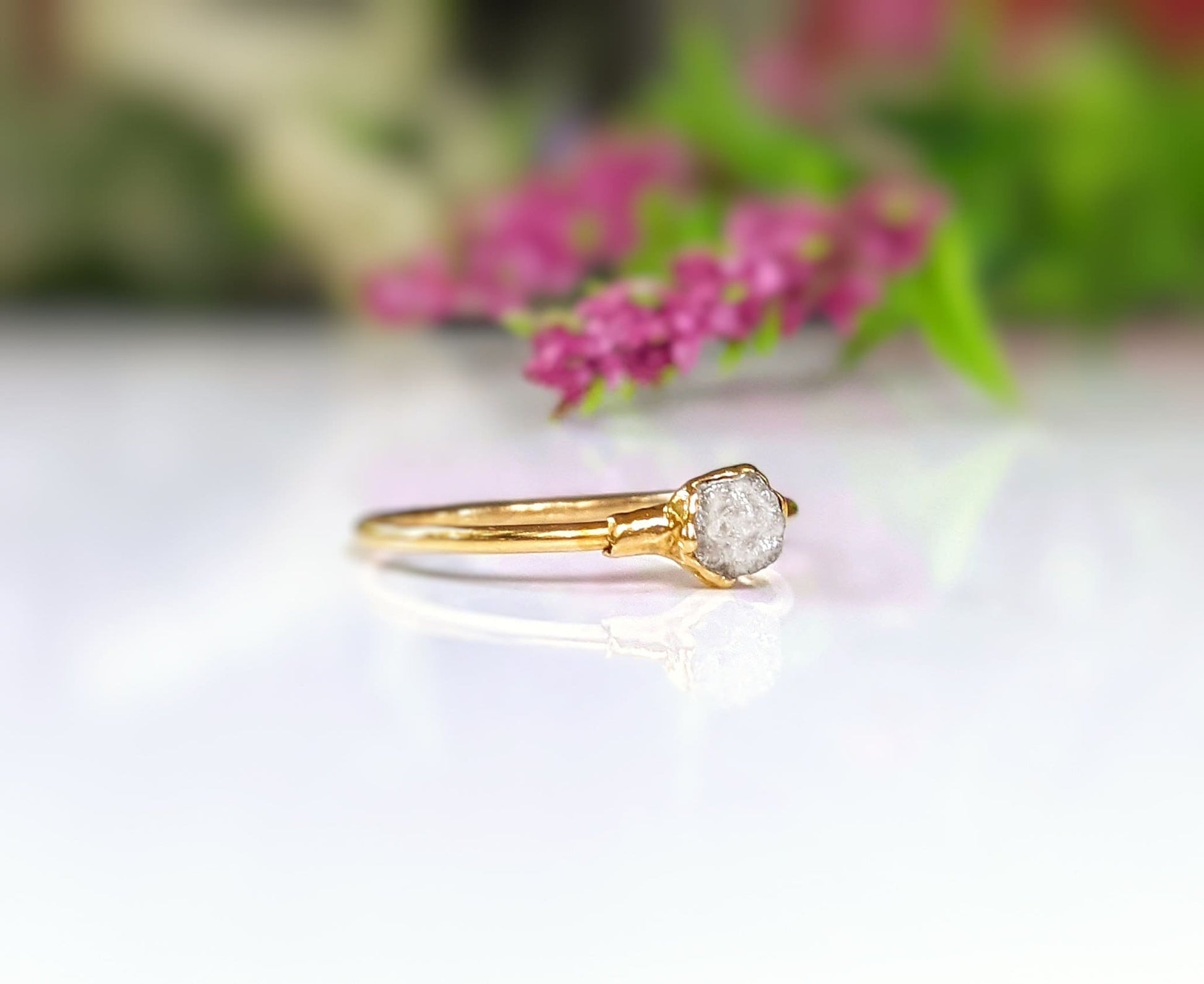 18k gold raw diamond engagement ring set with uncut diamond, featuring a unique and handcrafted design.