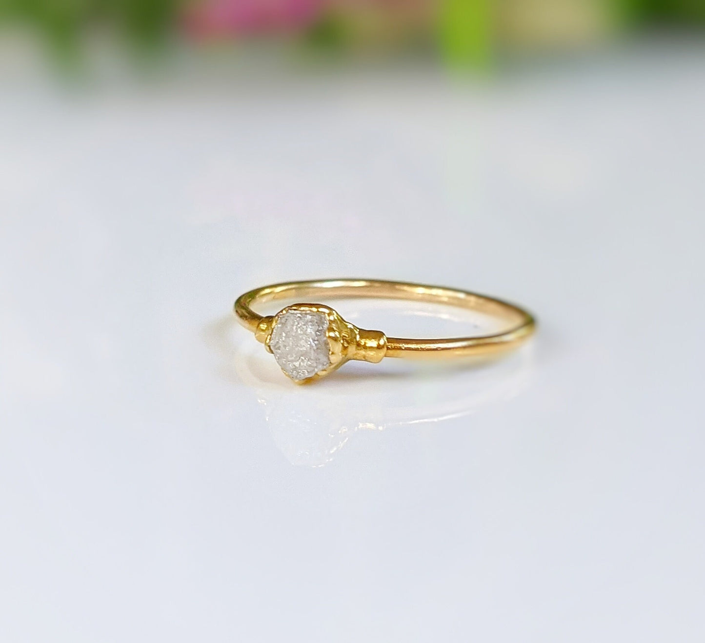 Raw diamond engagement ring set in 18k gold featuring a sparkly uncut diamond, perfect for unique love stories.
