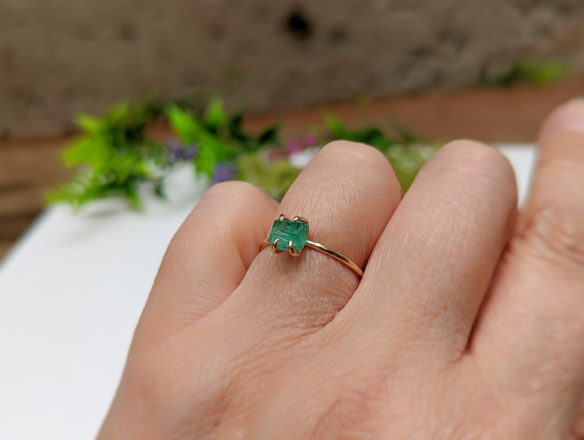 Raw emerald solitaire ring in solid 14k gold, handcrafted elegance for unique Valentine's Day gift.