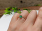 Raw emerald solitaire ring in solid 14k gold, handcrafted elegance for unique Valentine's Day gift.