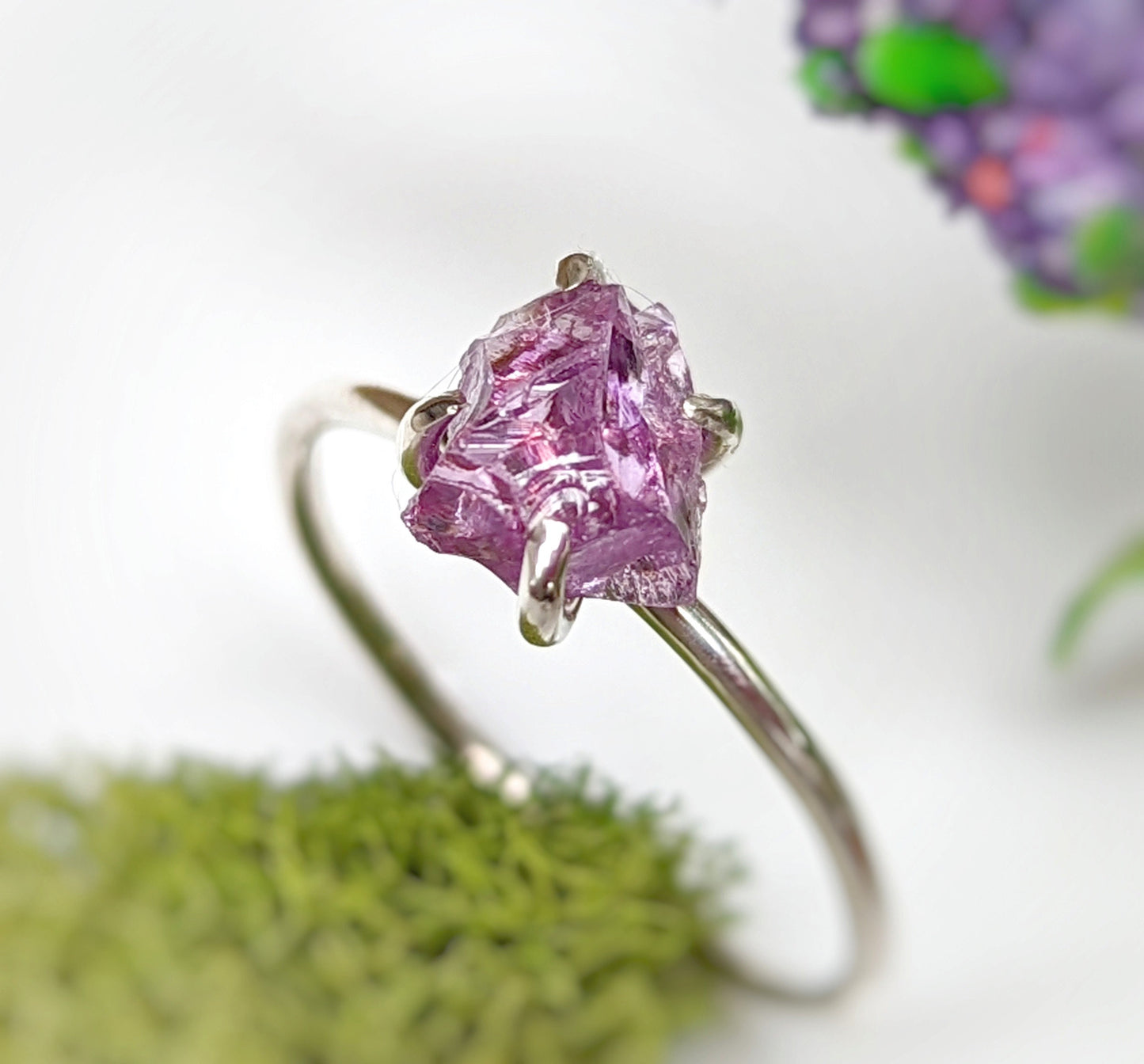 Handcrafted raw Alexandrite ring in sterling silver, showcasing a unique purple gemstone on a delicate band.