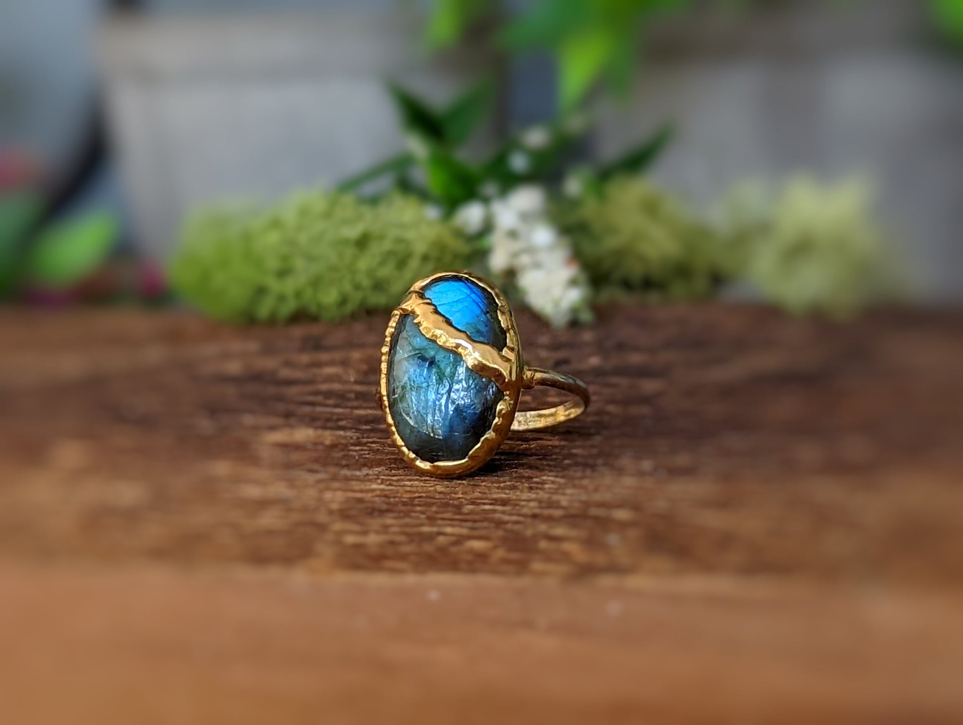 Labradorite Kintsugi ring in 18k gold plating, showcasing a vibrant blue stone with a unique gold join.