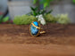 Labradorite Kintsugi ring in 18k gold plating, showcasing a vibrant blue stone with a unique gold join.