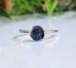 Handcrafted raw sapphire ring on silver band, perfect for nature lovers and September birthdays.