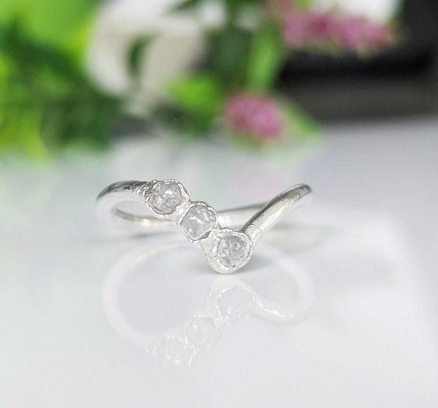 Raw diamond Chevron engagement ring in 14k gold, featuring three conflict-free diamonds, symbolizing unique love.