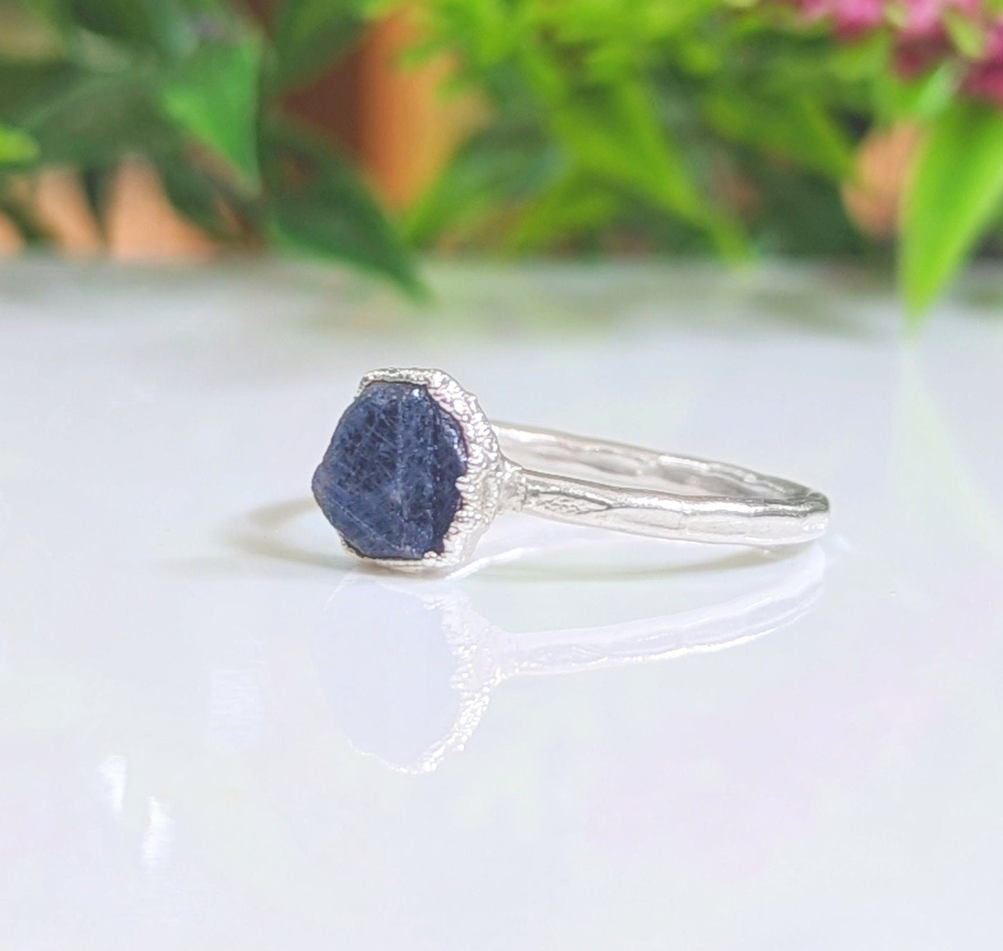 Stunning raw blue Sapphire ring on handcrafted Sterling Silver band, perfect as a unique promise or engagement ring.
