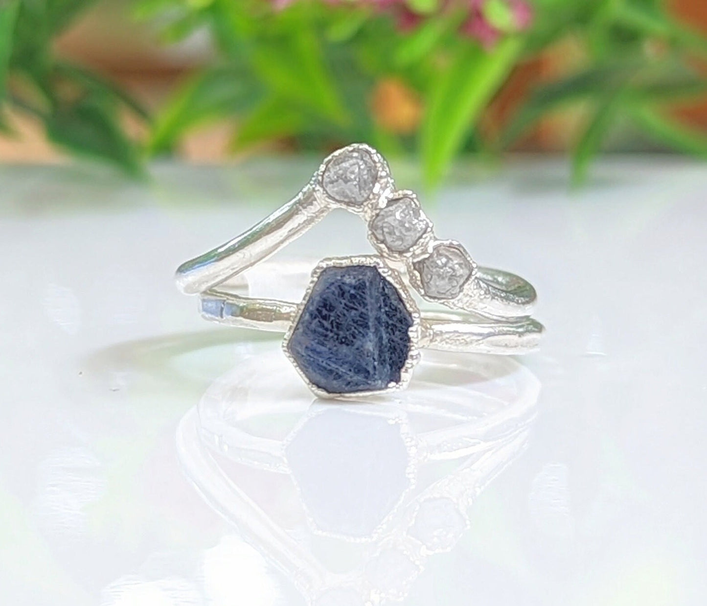 Stunning raw blue Sapphire ring on handcrafted Sterling Silver band, perfect for unique gifts and special occasions.