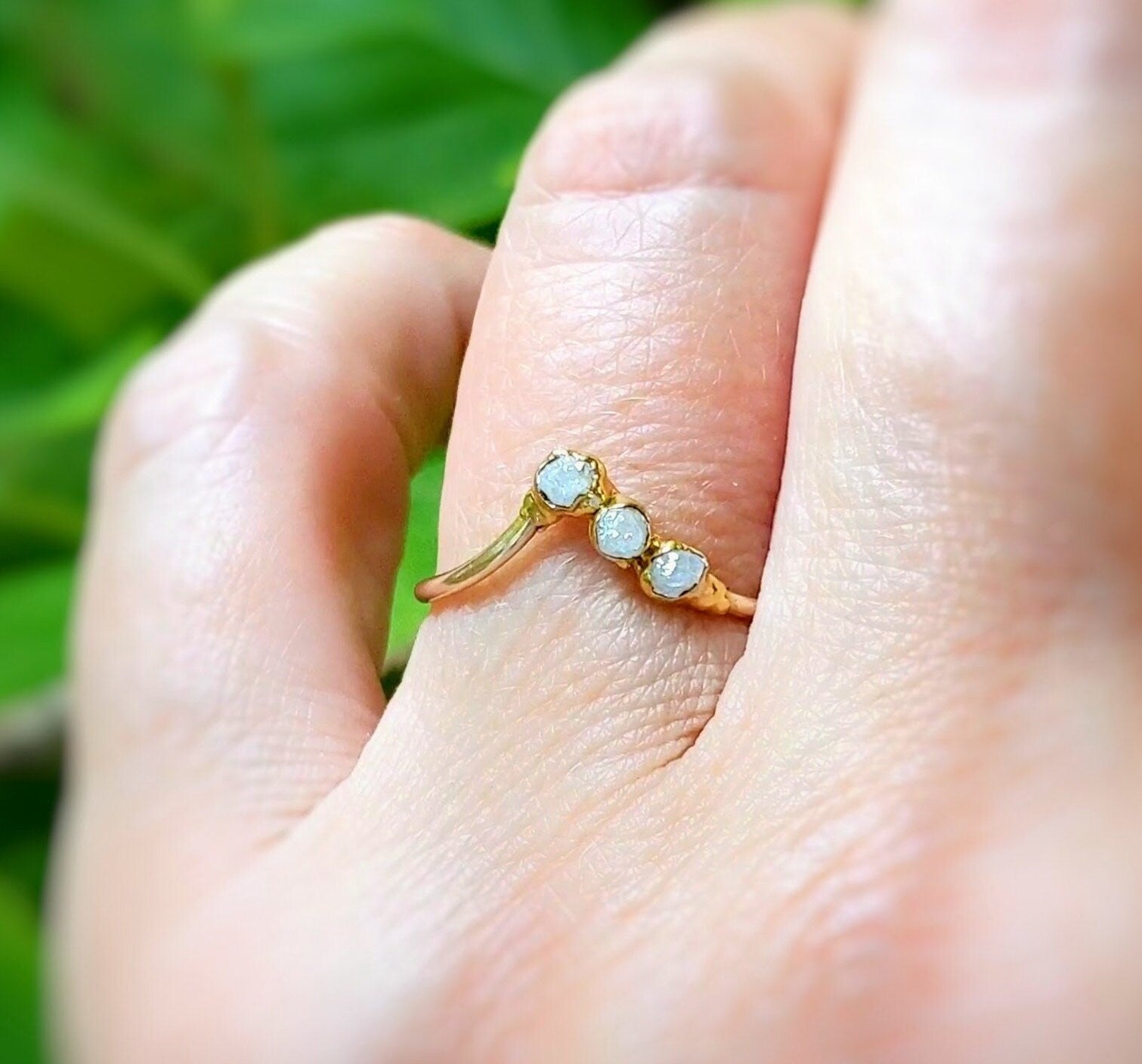 Handcrafted raw diamond Chevron engagement ring in 18k gold, featuring three conflict-free diamonds.