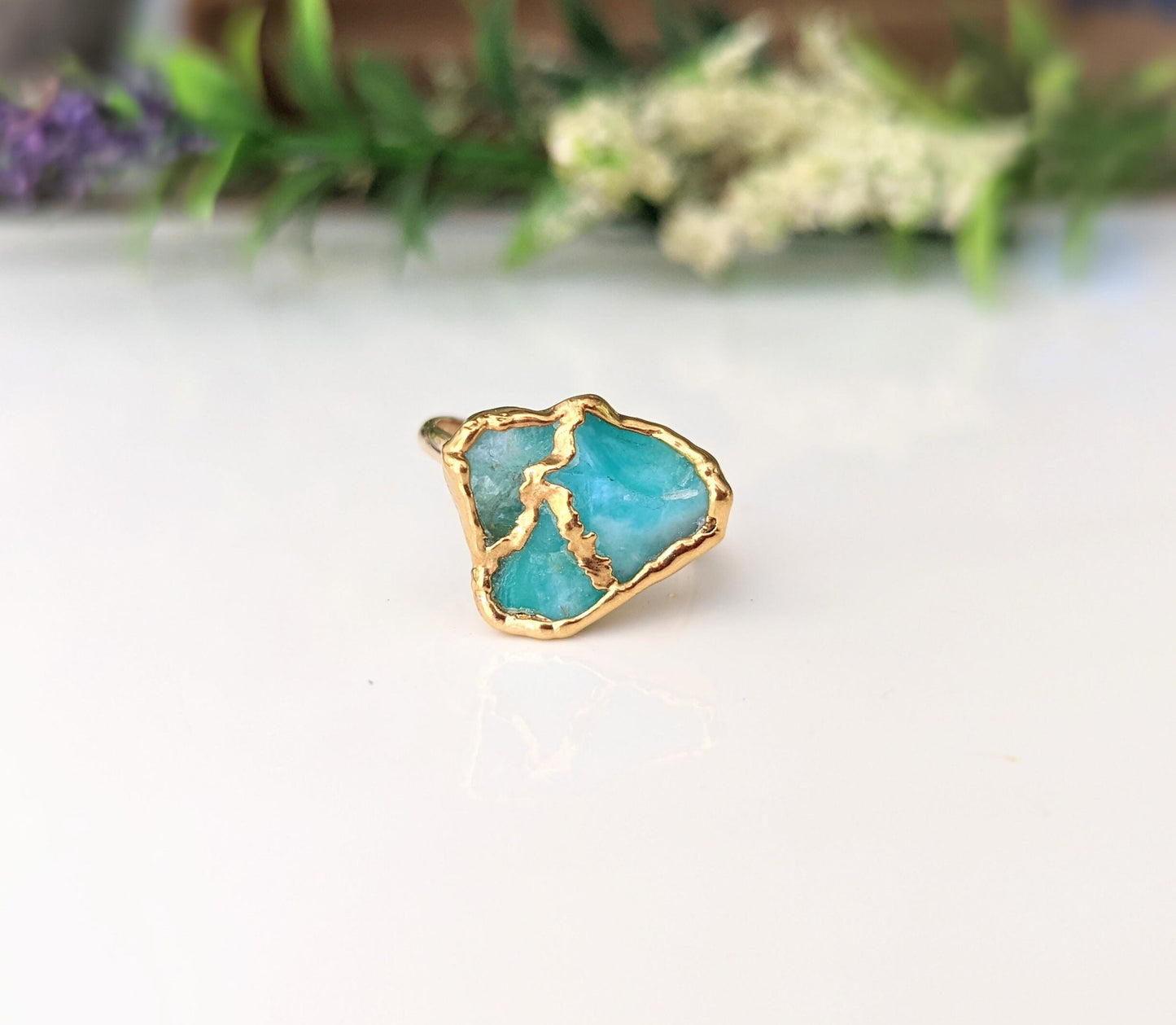 Raw Peruvian Opal Kintsugi ring featuring aqua blue opal with gold electroforming on a 14k Gold filled band.