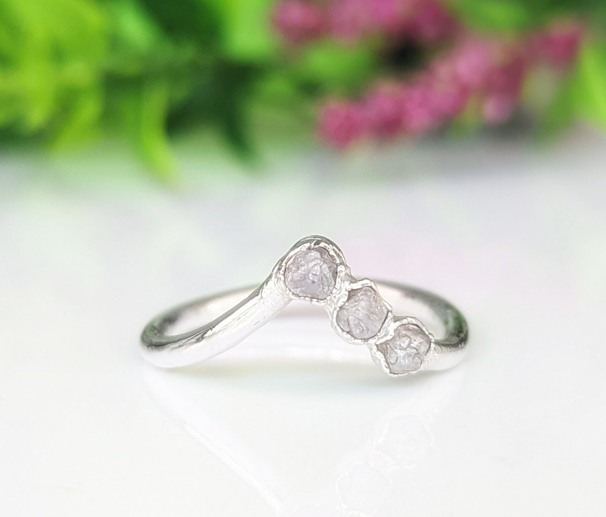 Raw diamond Chevron engagement ring in silver with three conflict-free diamonds, perfect for unique love commitments.