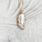 Elegant Kintsugi necklace featuring an oblong Keshi Pearl, handcrafted and plated in 18k Gold on a 21" chain.