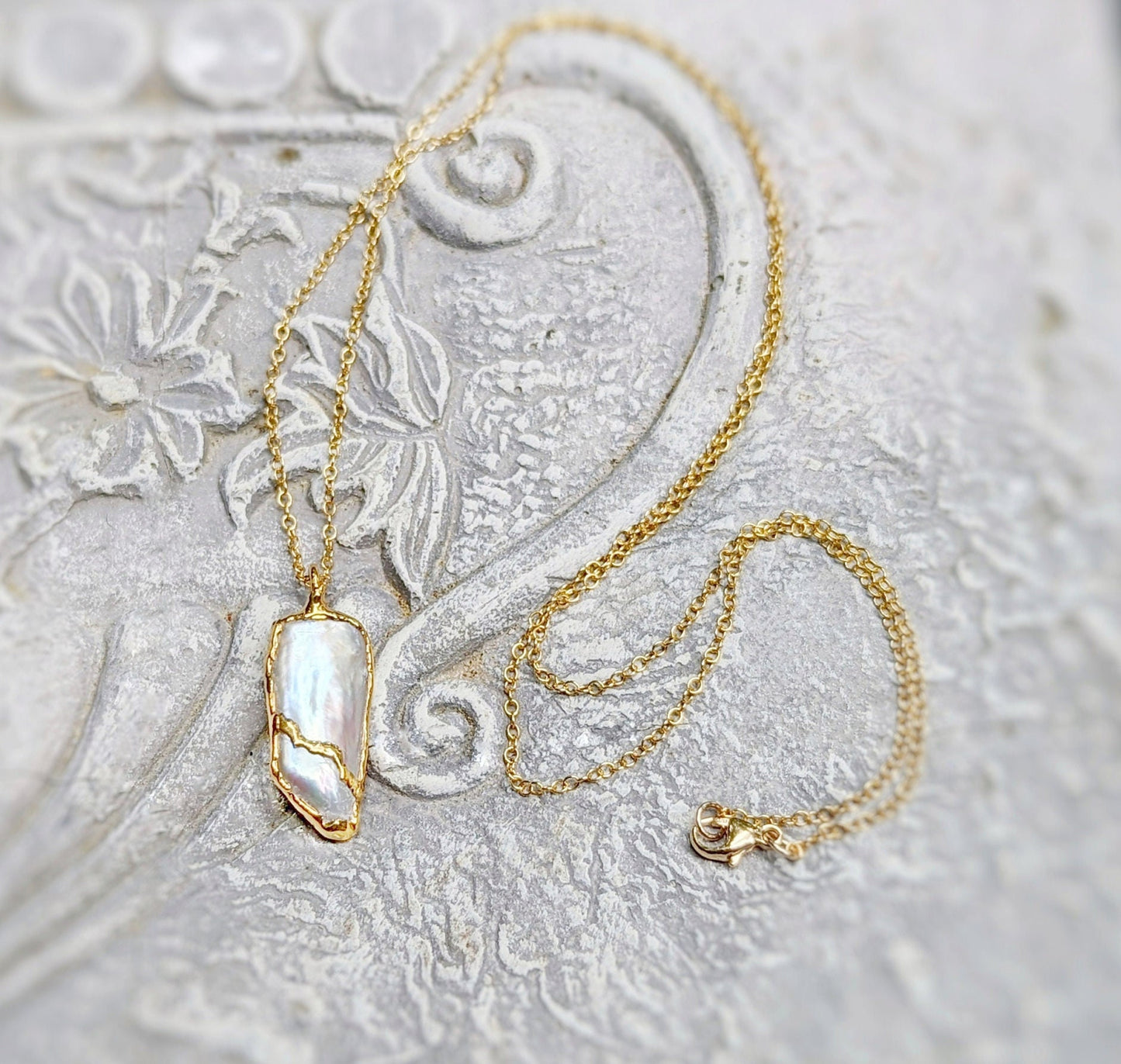 Kintsugi necklace featuring an oblong Keshi Pearl, 18k Gold plated, on a 14k gold filled chain, elegant gift for special occasions.