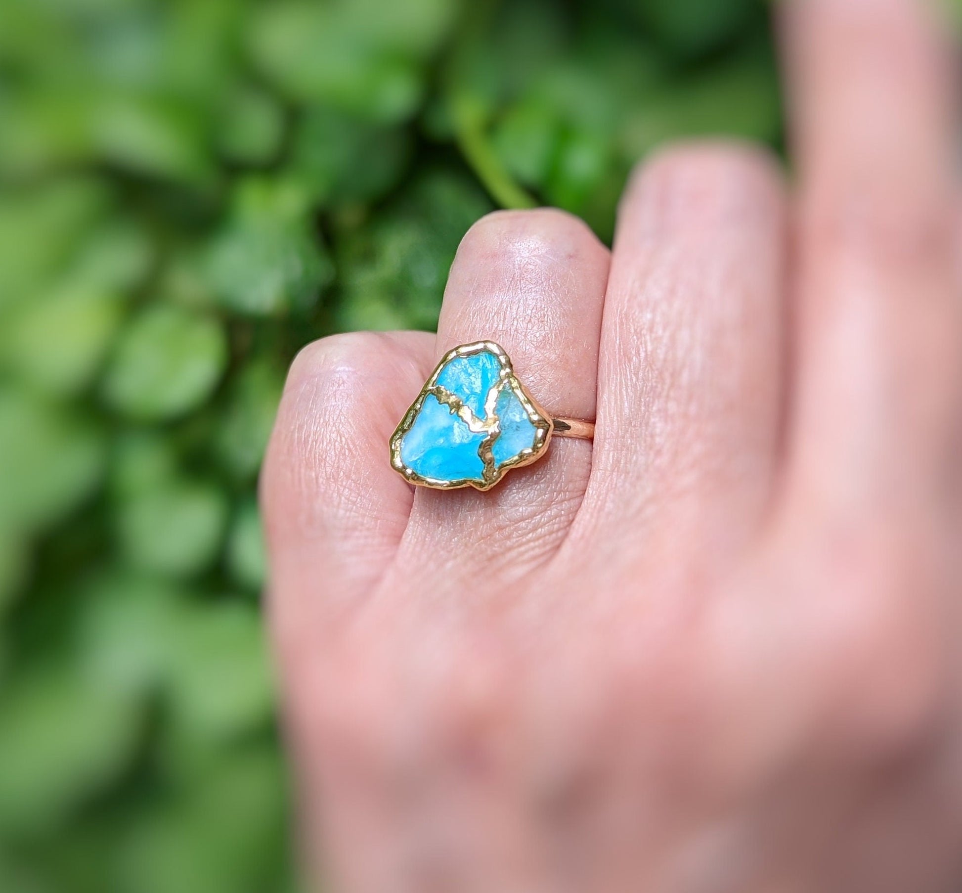 Stunning Aqua blue raw Peruvian Opal Kintsugi ring on hand, handcrafted with 14k Gold filled band and 18k Gold plating.