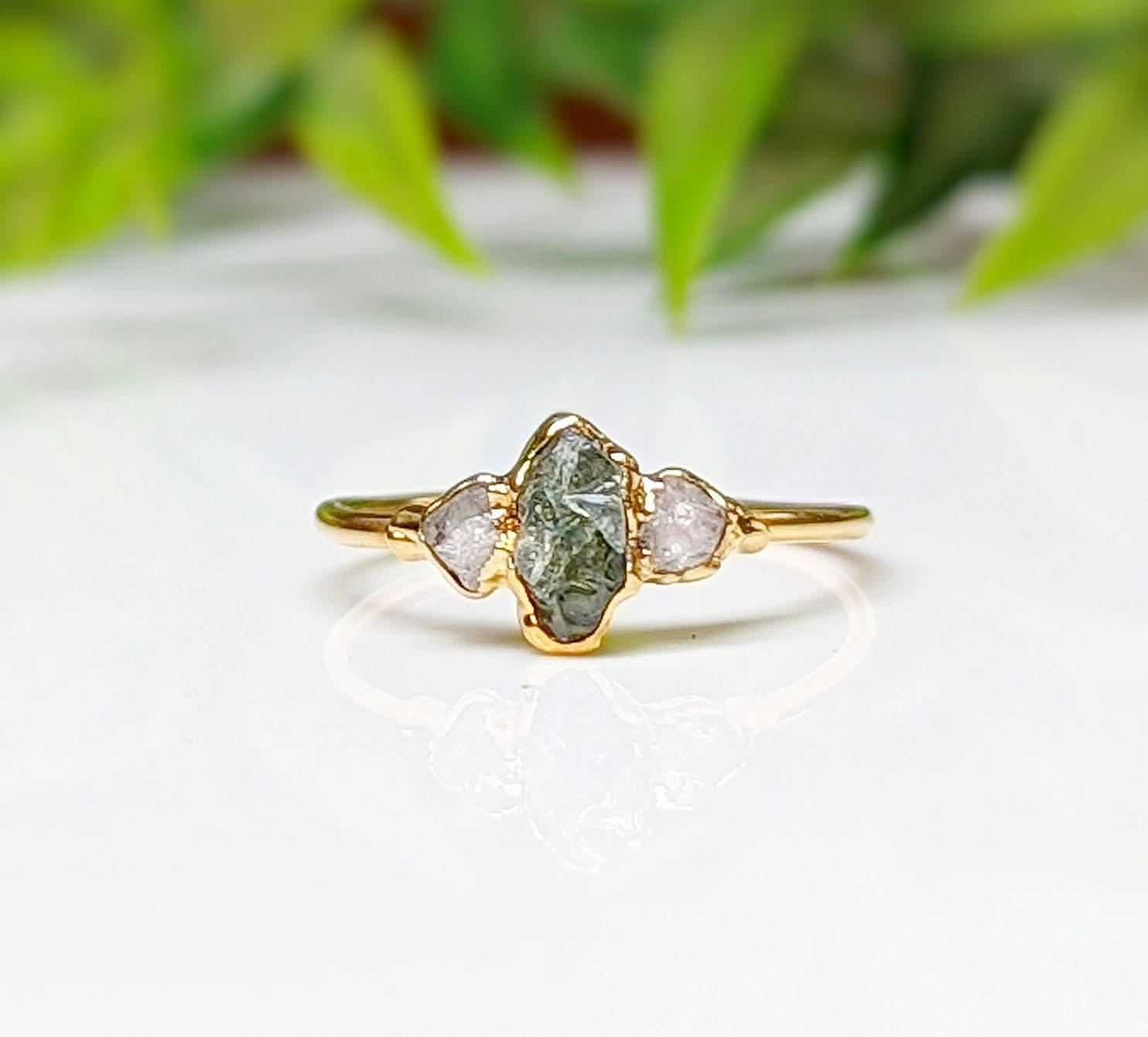 Raw green sapphire and diamond engagement ring handcrafted in 14k gold, perfect for promises or special gifts.