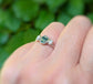 Handcrafted Moss Agate and Herkimer diamond engagement ring in silver, showcasing rustic elegance.