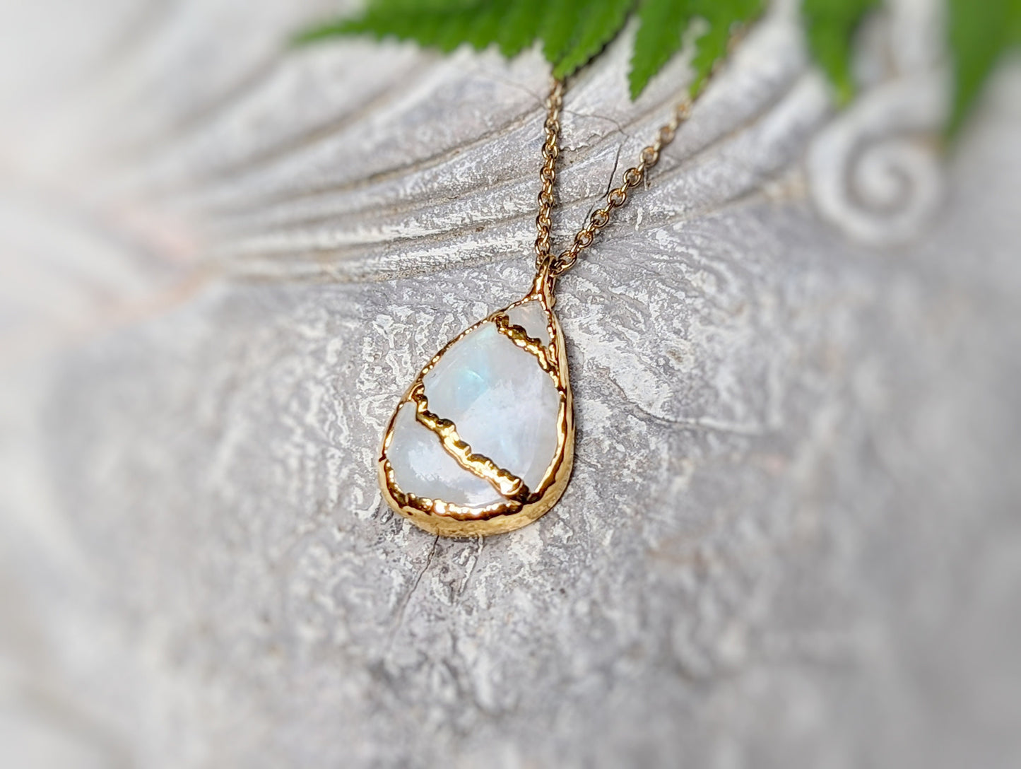 Rainbow Moonstone Kintsugi necklace featuring a pear shape, 18k gold plating, on a delicate chain.