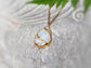 Rainbow Moonstone Kintsugi necklace featuring a pear shape, 18k gold plating, on a delicate chain.