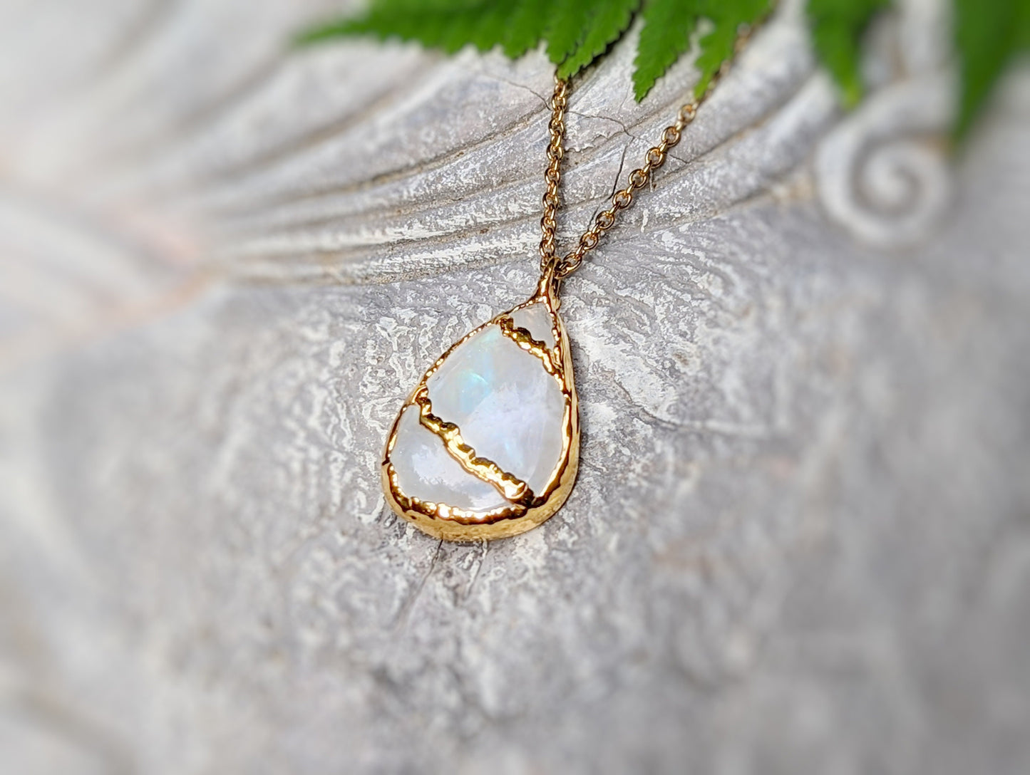 Handcrafted Rainbow Moonstone Kintsugi necklace, 18k gold plated with a pear shape pendant on a 14k gold filled chain.