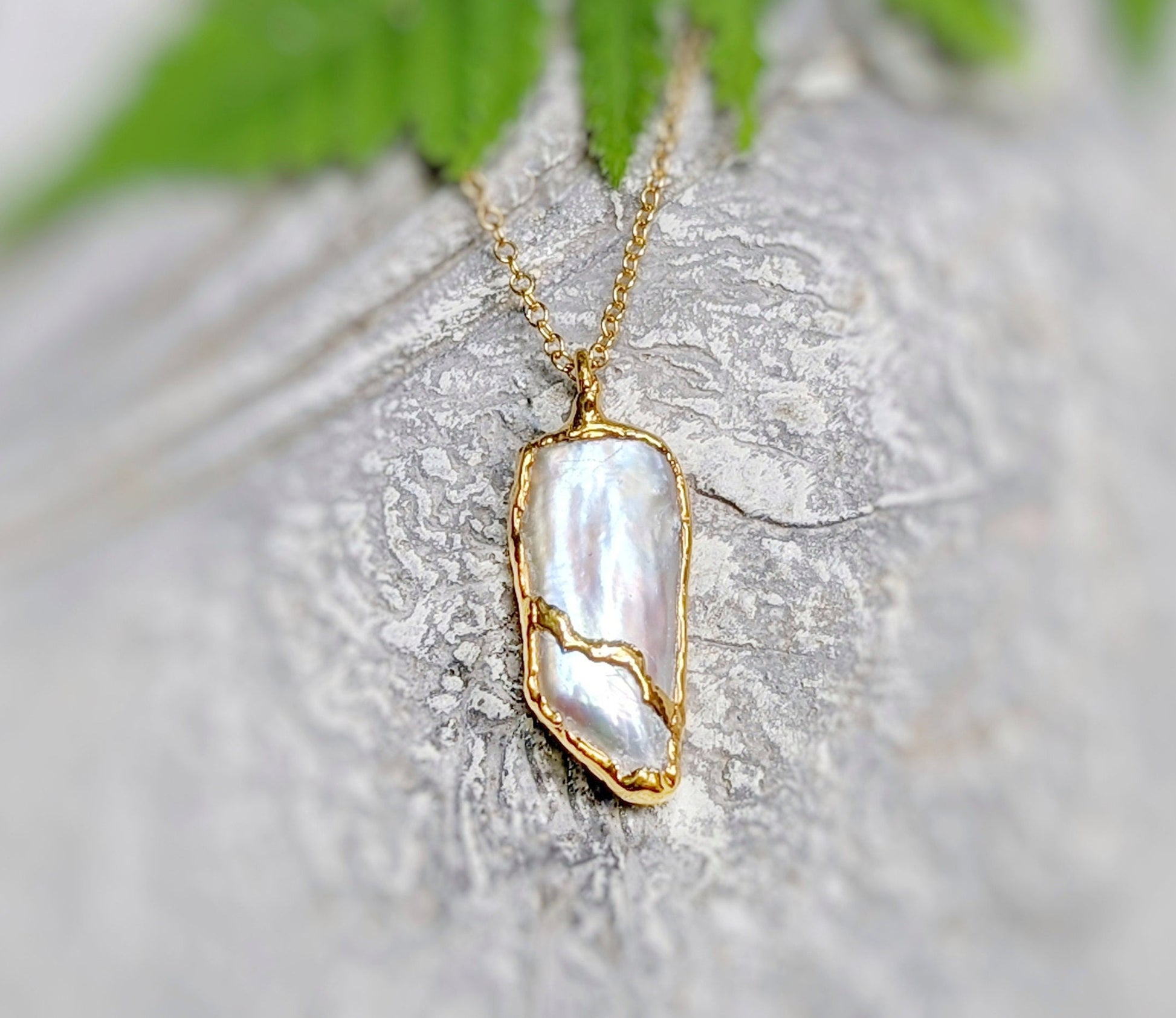 Freshwater Biwa Keshi Pearl Kintsugi necklace, handcrafted gold-plated pendant on a delicate chain.