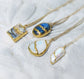 Collection of Kintsugi necklaces featuring unique gemstones set in gold, elegant jewelry for special occasions.