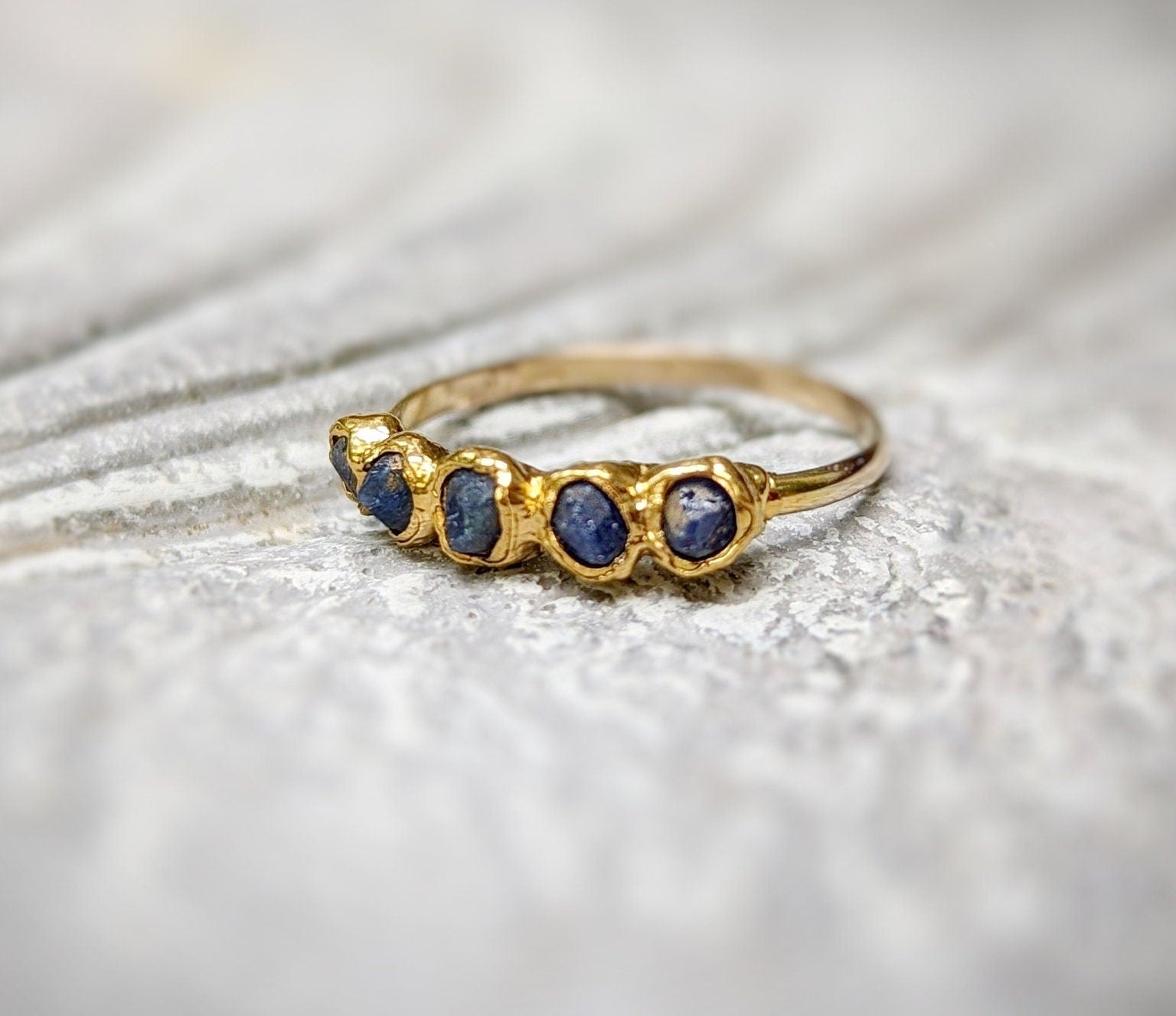 Raw sapphire multi-stone ring on a solid 14k gold filled band, featuring unique handcrafted design.