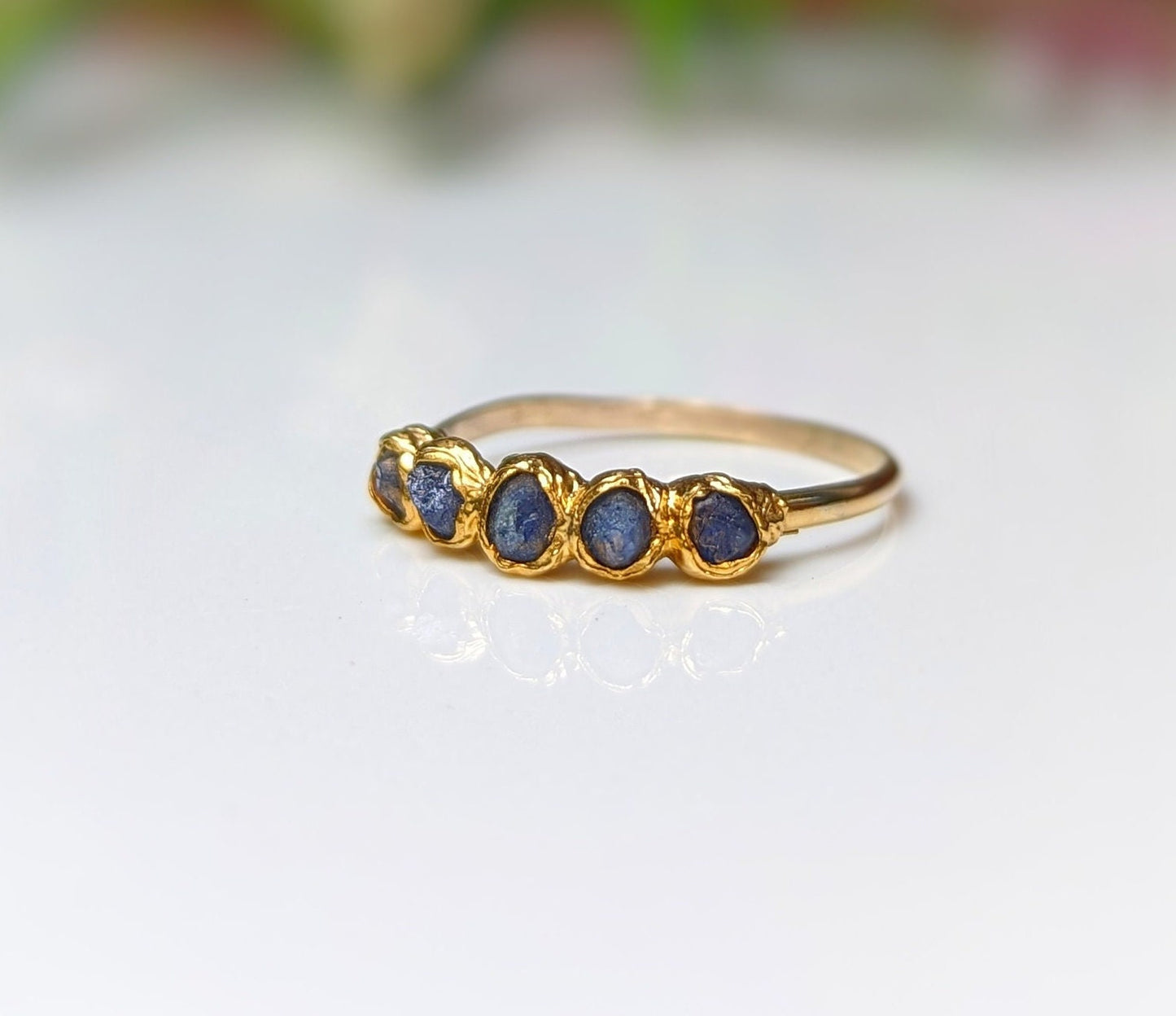 Handcrafted raw Sapphire multi-stone ring on a solid 14k Gold filled band, showcasing blue sapphires.