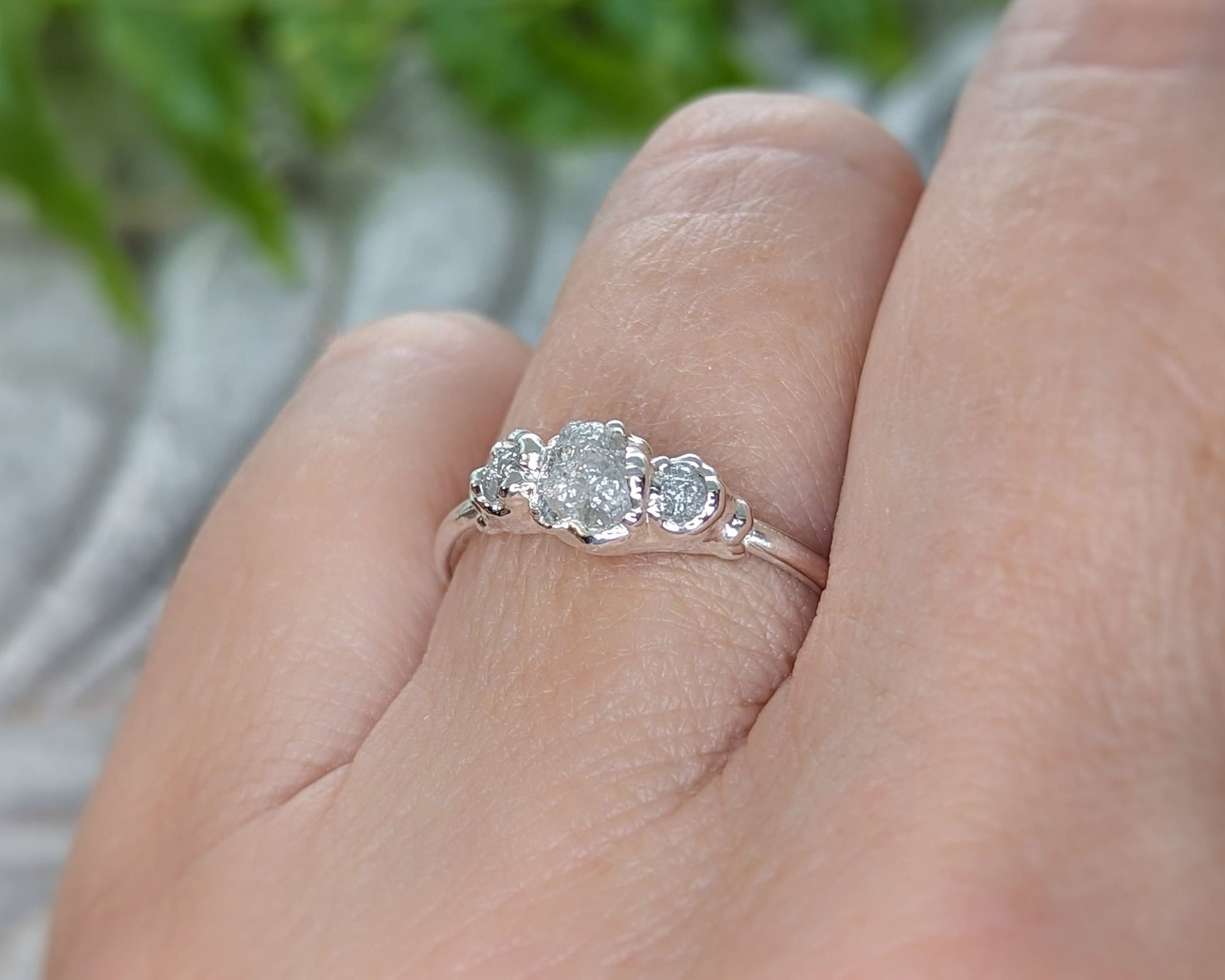 Raw multi diamond engagement ring featuring rustic uncut diamonds on a solid gold band, showcasing unique craftsmanship.