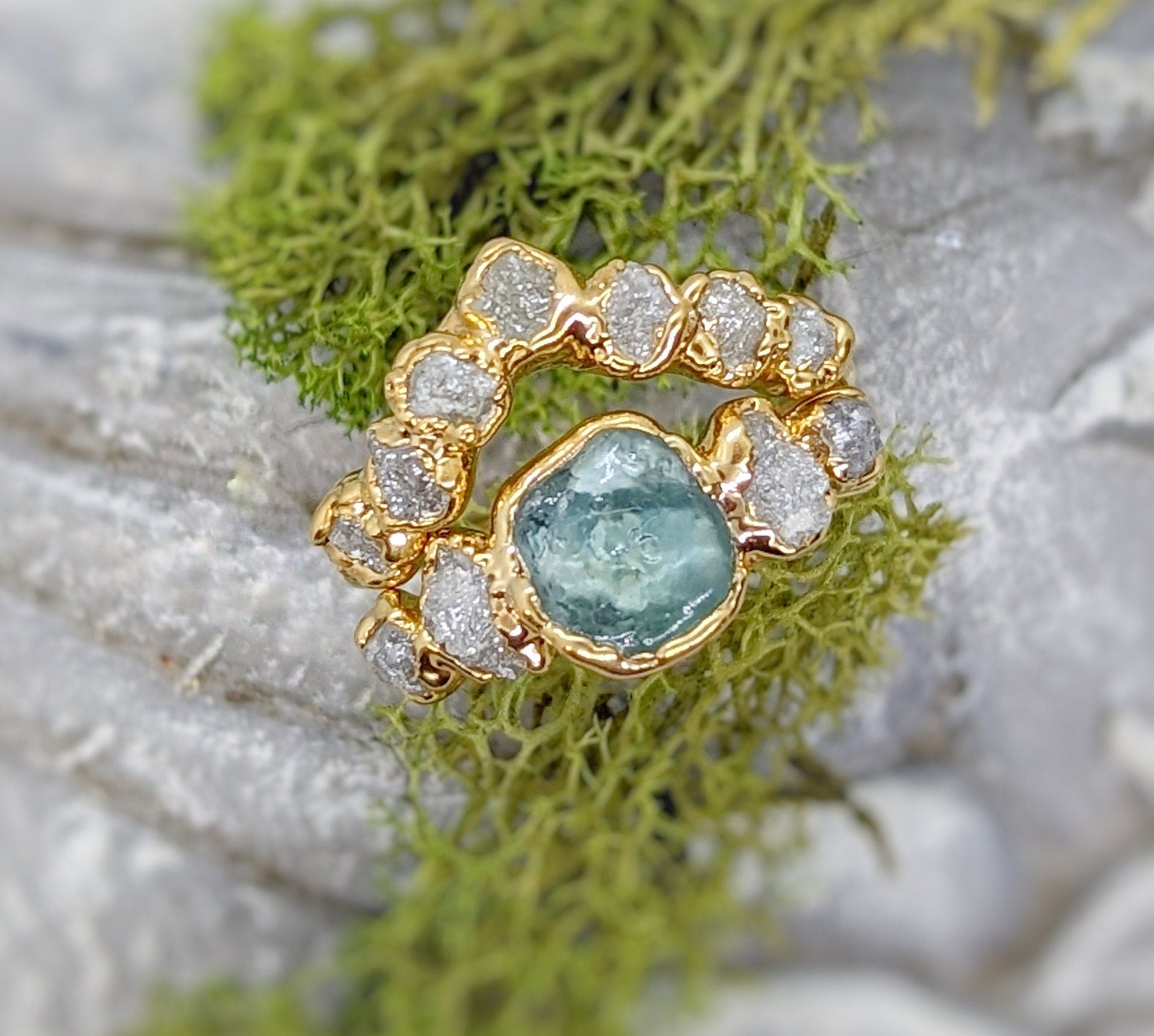 Raw Montana Sapphire and diamond ring set in solid 14k gold, uniquely handcrafted wedding jewelry.