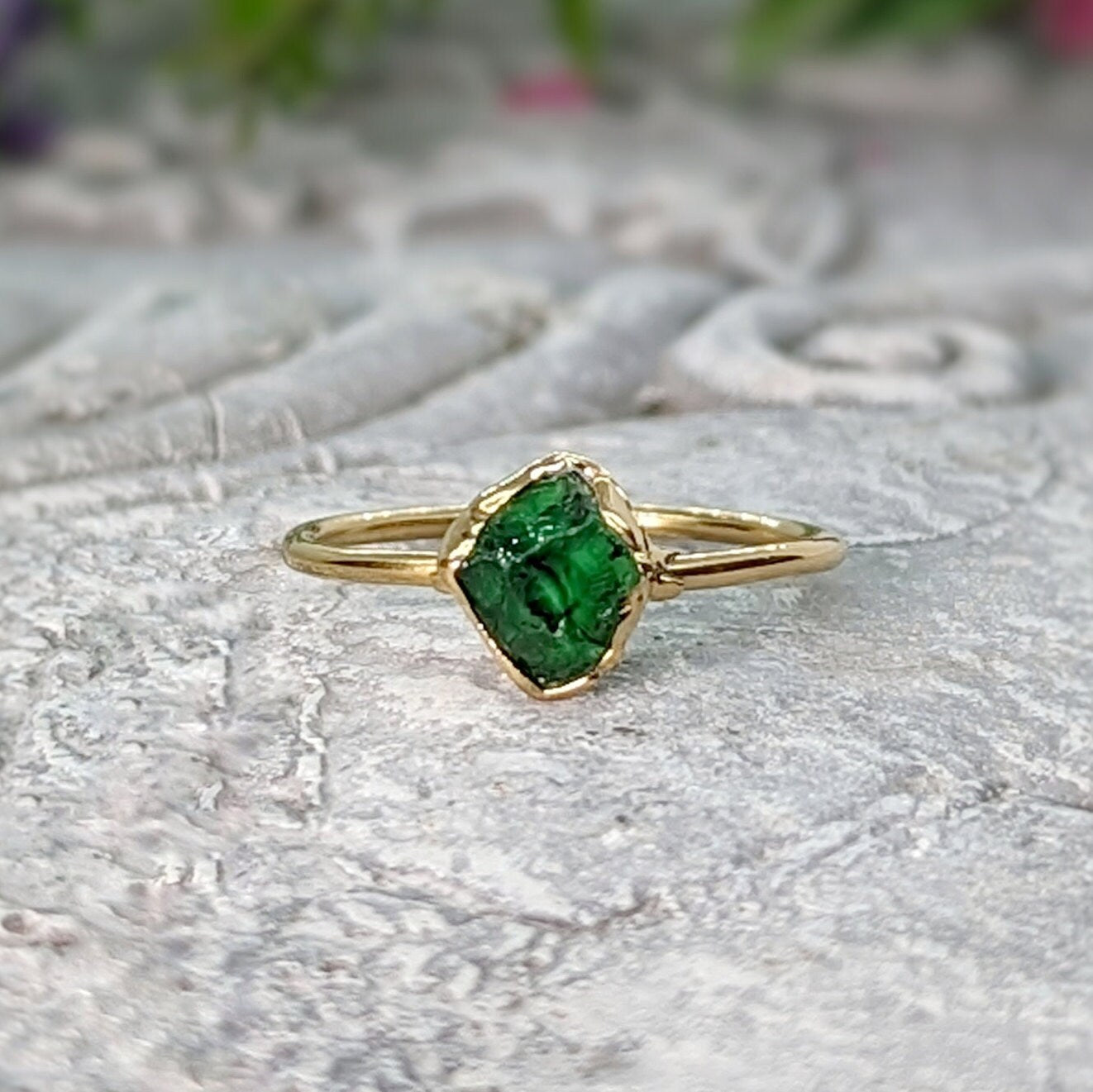 Handcrafted raw green Garnet ring set in gold, showcasing its unique natural beauty and earthy charm.