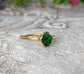 Raw green Garnet ring handcrafted in gold, showcasing a natural uncut crystal with earthy edges.